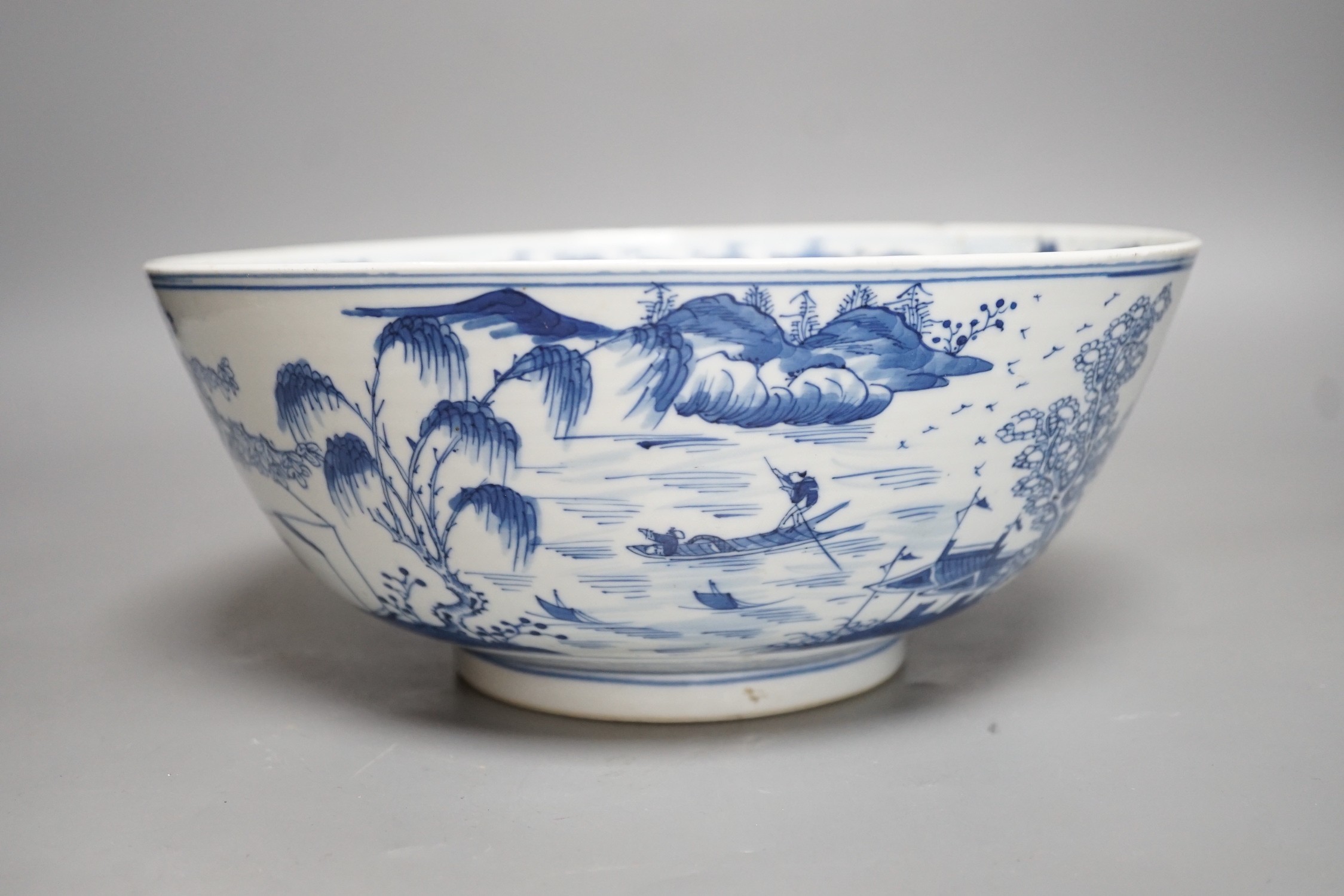 A 19th century Chinese blue and white landscape bowl, 26cm